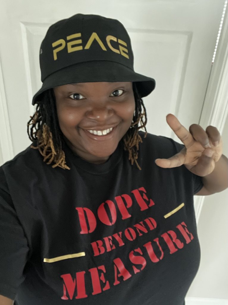Customer wearing a custom-printed PEACE bucket hat and DOPE BEYOND MEASURE tee by Kreative Additions LLC